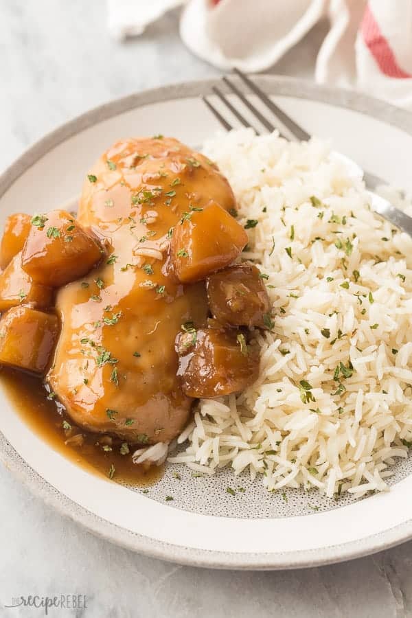 instant pot pineapple chicken breasts on grey plate with white rice