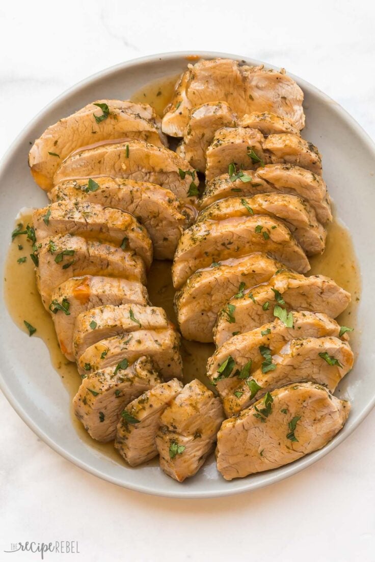 overhead image of sliced instant pot pork tenderloin on plate with glaze