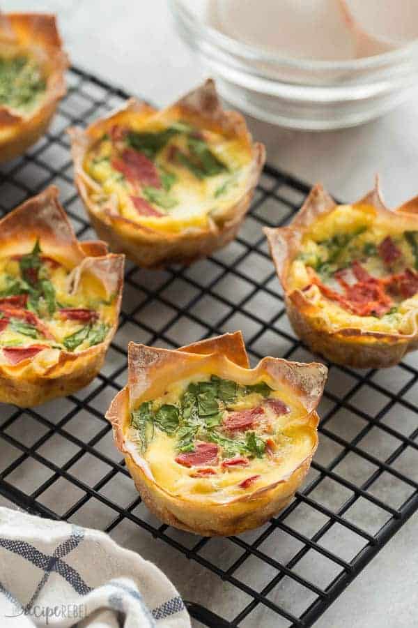 mini quiche on a black cooling rack close up