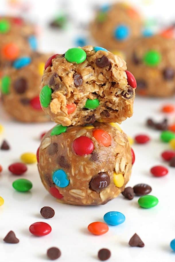 no bake monster cookie balls stack of two with bite taken from top ball