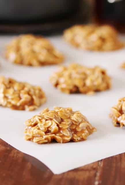 maple no bake cookies on piece of parchment paper on wooden table