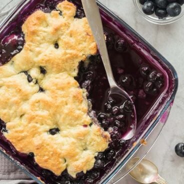 blueberry cobbler in a glass pan overhead