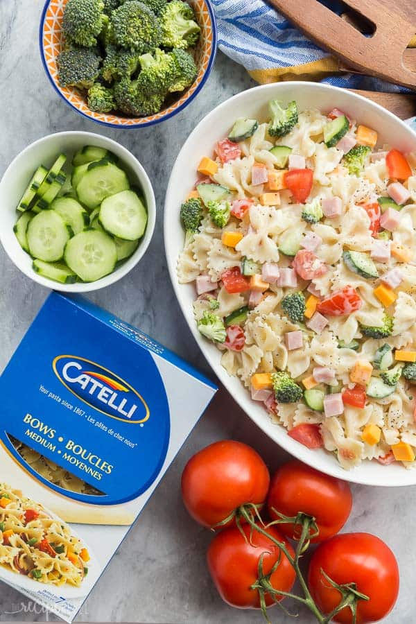 ranch pasta salad in a large bowl with vegetables on the side and box of Catelli pasta bows