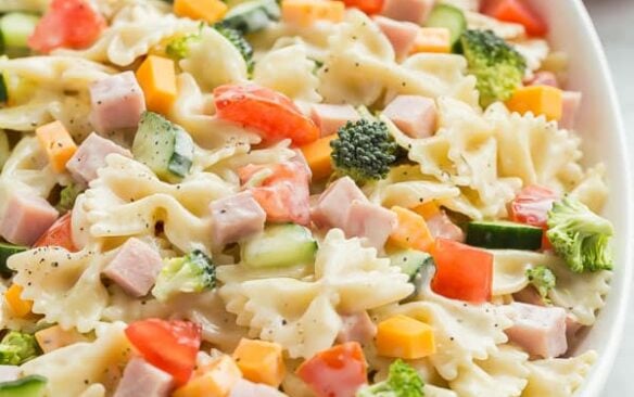 creamy ranch bowtie pasta salad in a large bowl