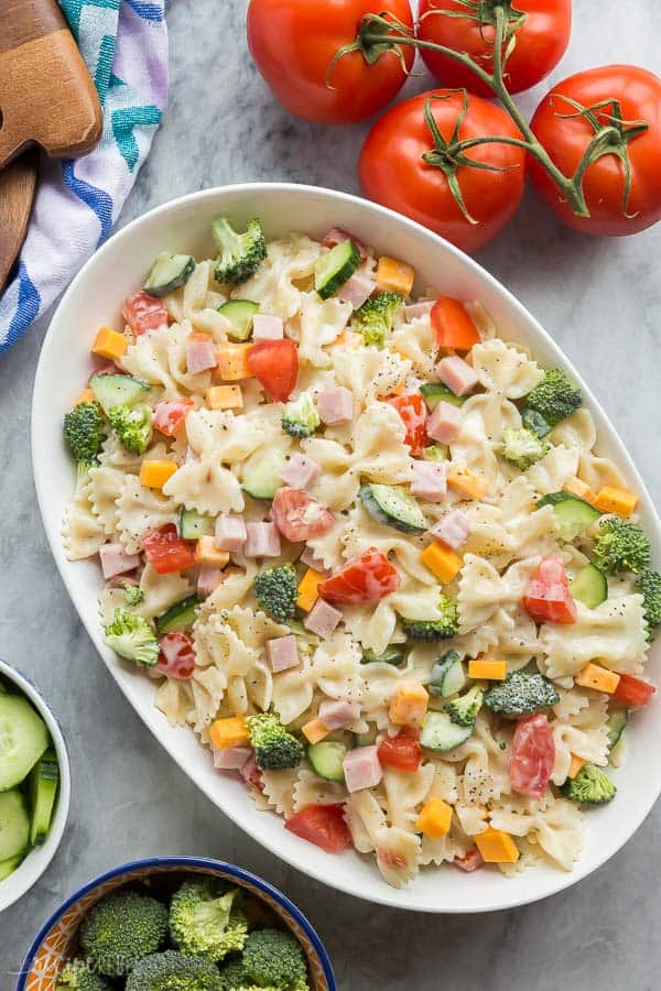 ranch bowtie pasta salad overhead in large white bowl on marble background