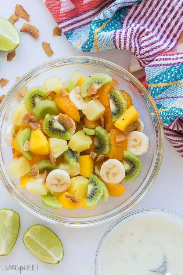 hawaiian fruit salad overhead in glass bowl with dressing on the side