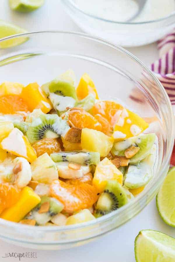 hawaiian fruit salad in a bowl close up with drizzle of dressing