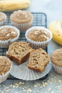 banana oatmeal muffins on a rack cut in half
