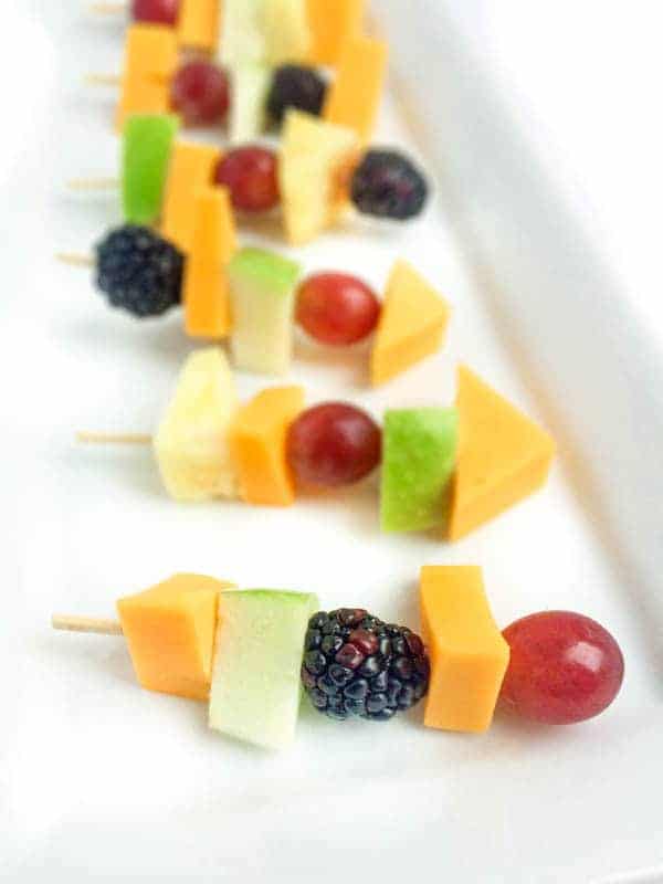 All kinds of kabob recipes for summer grilling! Chicken kabobs, shrimp kabobs, steak kabobs, and dessert kabobs! Because food on a stick is more fun ;) fruit and cheese kabobs with apples grapes berries and cheese chunks