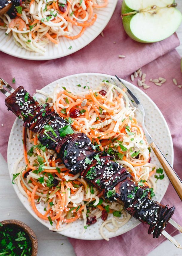 All kinds of kabob recipes for summer grilling! Chicken kabobs, shrimp kabobs, steak kabobs, and dessert kabobs! Because food on a stick is more fun ;) ahi tuna kabobs on white plate over spiralized vegetables