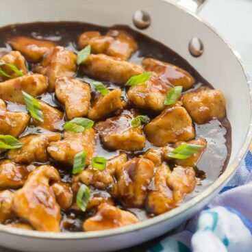 orange chicken in white pan