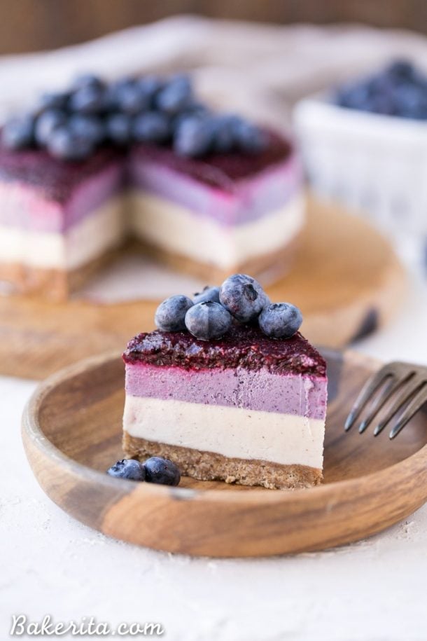 no bake layered blueberry cheesecake on a wooden plate