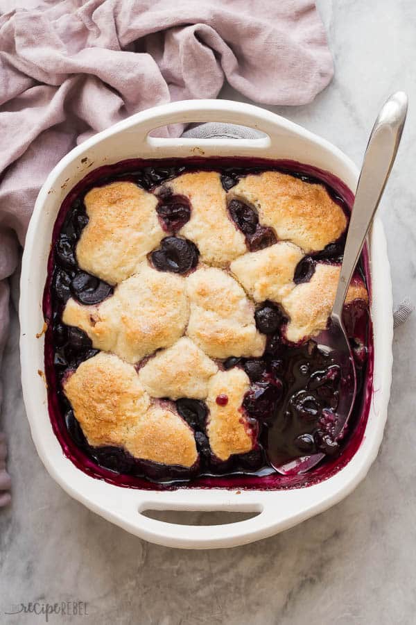 overhead image of cherry cobbler in white baking dish