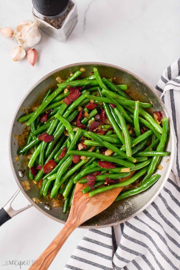 green beans added to bacon and onions in skillet