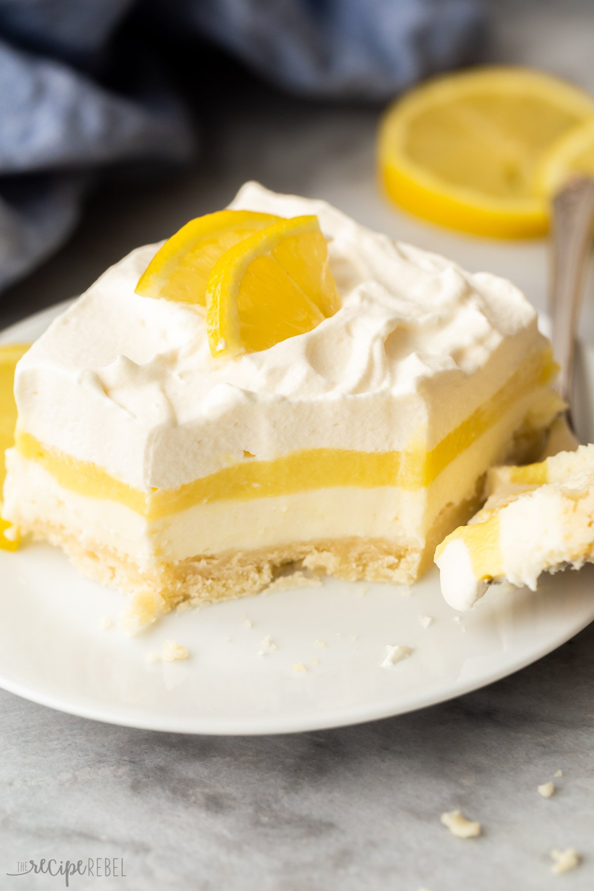 close up image of piece of lemon lush with bite taken out