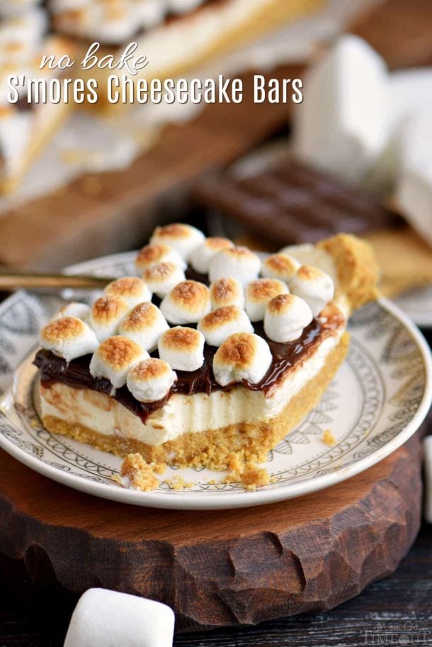 s'mores cheesecake bars with toasted marshmallows on top