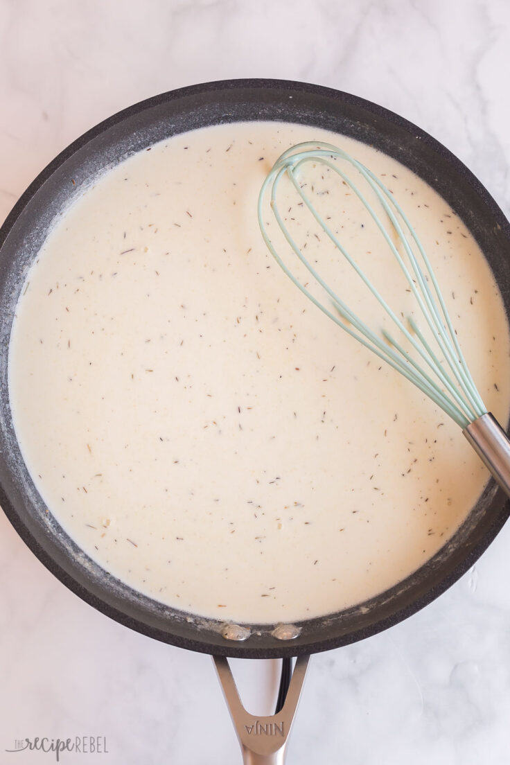 scalloped potato sauce in black skillet