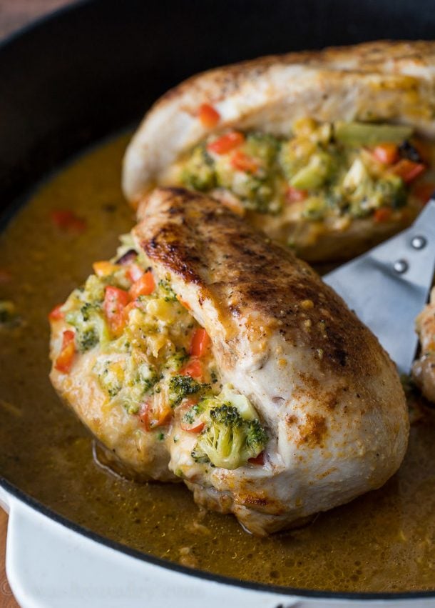 broccoli cheese stuffed chicken breasts close up in a skillet