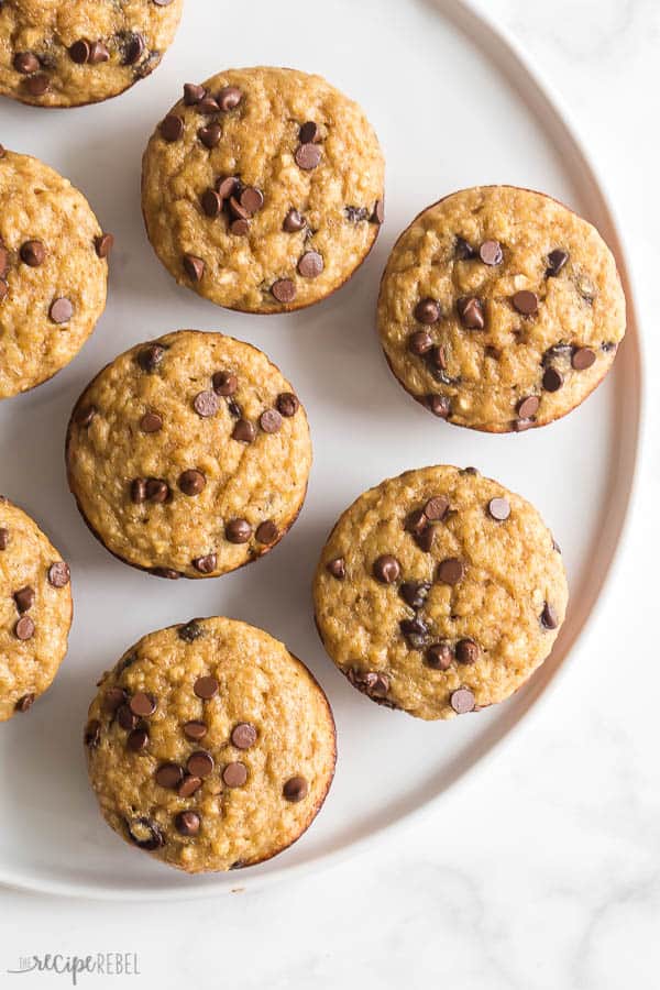 banana oatmeal muffins overhead on large white plate on white background