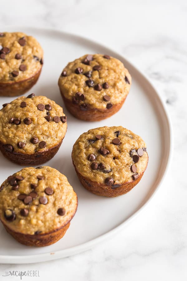 banana oatmeal muffins on white plate with mini chocolate chips on top