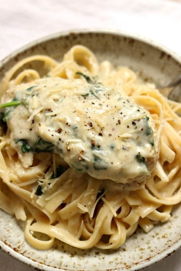 instant pot creamy garlic chicken breast over fettuccine