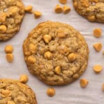 square image of oatmeal butterscotch cookie on a baking sheet.