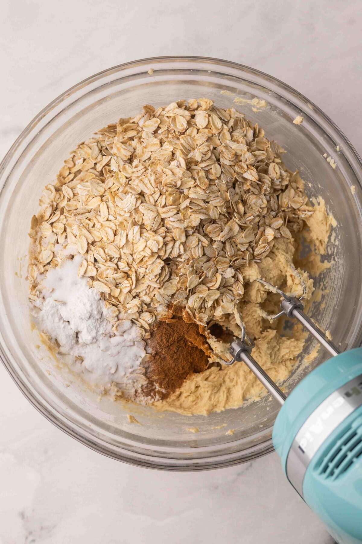 dry ingredients added to oatmeal cookie dough.