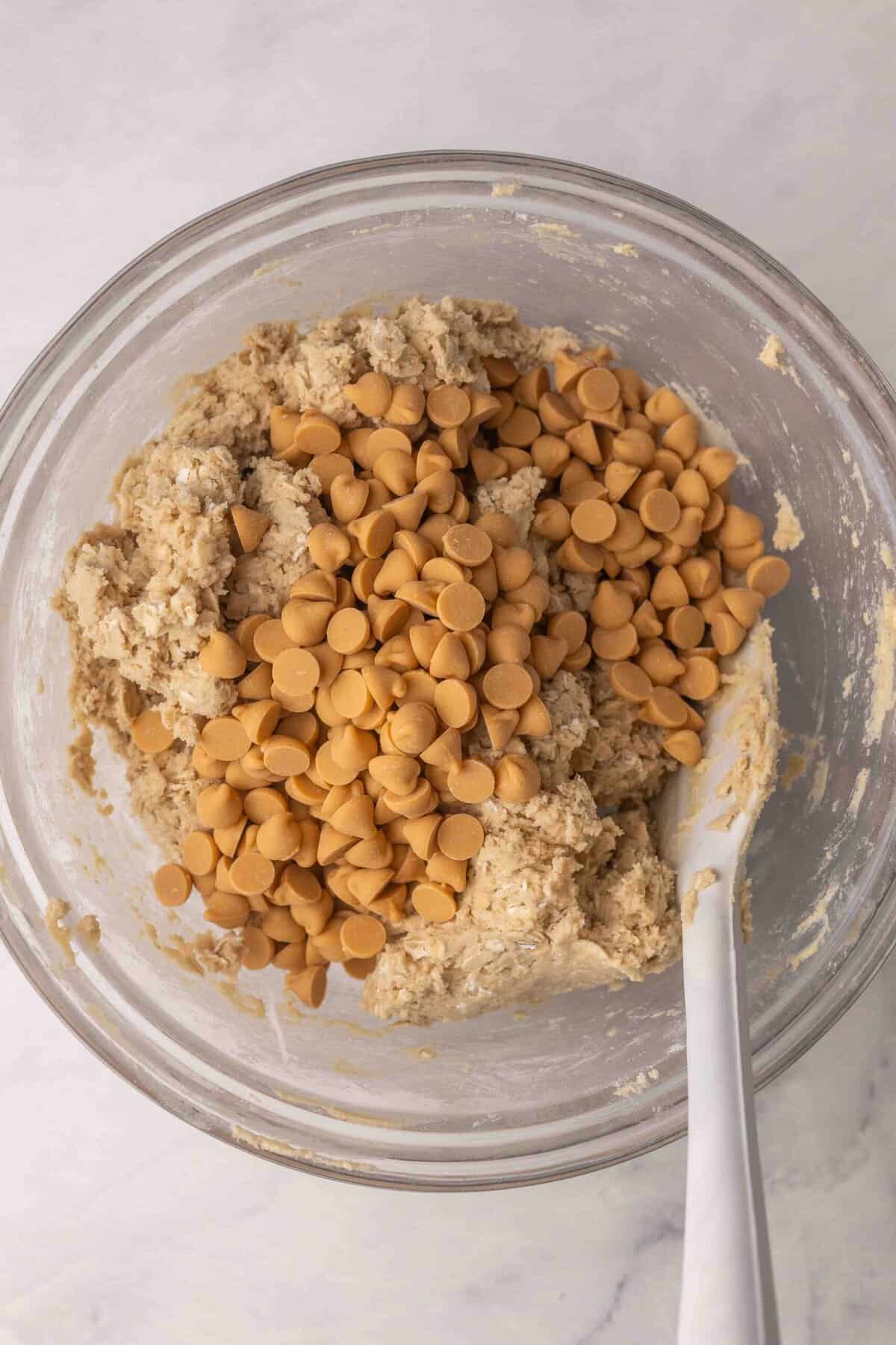 stirring butterscotch chips into cookie dough.