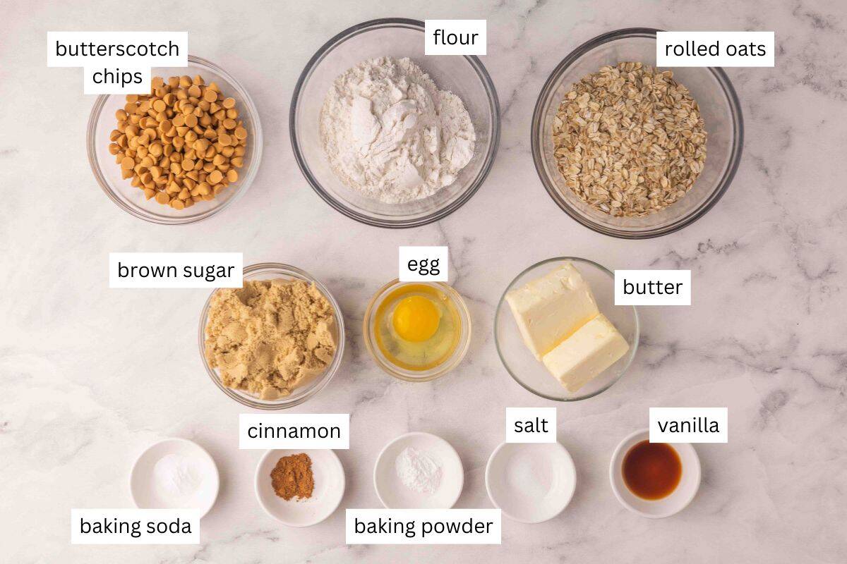 These Oatmeal Butterscotch Cookies (Oatmeal Scotchies) are soft, chewy, and loaded with butterscotch chips! Perfectly chewy and no chilling required! #cookie #recipe #baking | cookie recipes | oatmeal cookies | no chill cookies | easy cookie recipes | easy recipes | easy baking recipes ingredients needed for oatmeal butterscotch cookies on a white background.