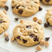 These Peanut Butter Chocolate Chip Cookies are a family favorite! They're soft and chewy and never fluffy! Loaded with chocolate chips and peanut butter chips, they are sure to please the Reese's peanut butter cups lovers in your house! Includes step by step recipe video!