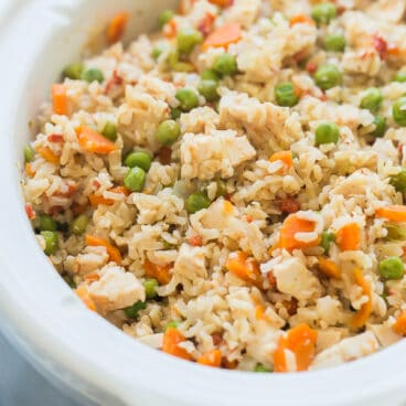 slow cooker chicken and rice in white crockpot