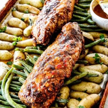 chili dijon pork tenderloin on sheet pan with potatoes and green beans.