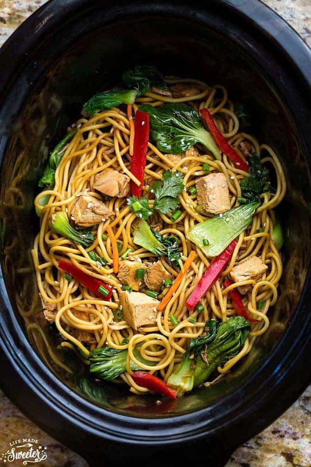 crockpot chicken lo mein in black slow cooker overhead