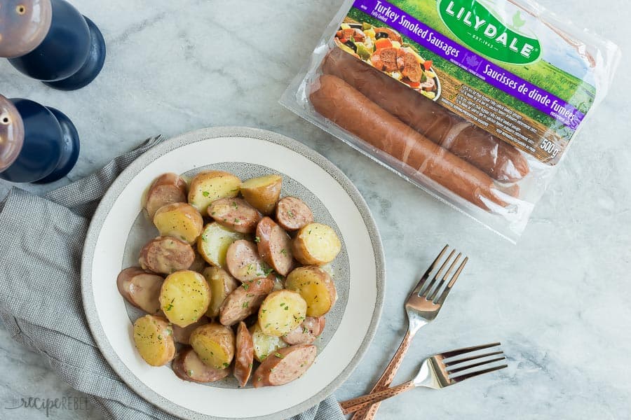 instant pot sausage and potatoes overhead on grey marble background with package of lilydale turkey sausages on the side