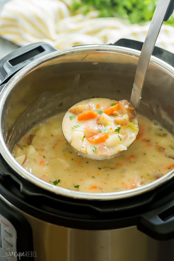 instant pot potato soup in pressure cooker with a metal ladle pulling up a scoop of soup