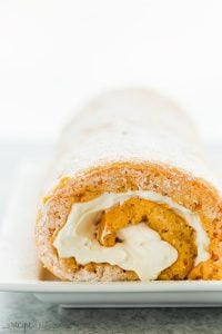 This Lighter Pumpkin Roll is an easier, lighter version of the classic Libby's pumpkin roll. It's made with just a few ingredients but your guests will never know how quickly it came together! Includes step by step recipe video. #pumpkin #cake #dessert #recipe #baking #fall #thanksgiving