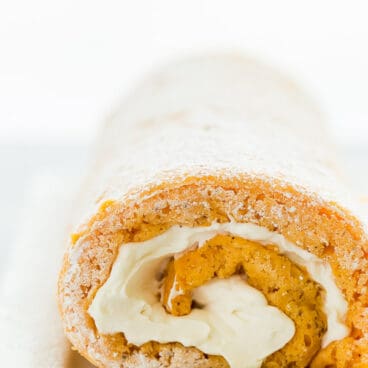 This Lighter Pumpkin Roll is an easier, lighter version of the classic Libby's pumpkin roll. It's made with just a few ingredients but your guests will never know how quickly it came together! Includes step by step recipe video. #pumpkin #cake #dessert #recipe #baking #fall #thanksgiving