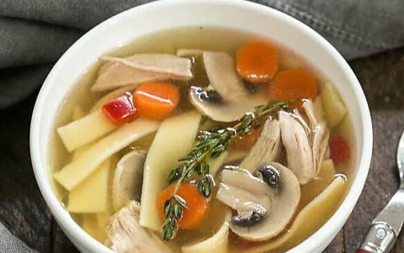 instant pot chicken stock with vegetables in bowl