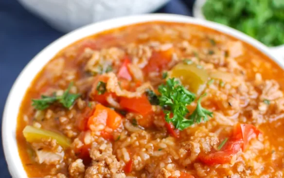 instant pot stuffed pepper soup in white bowl with spoon