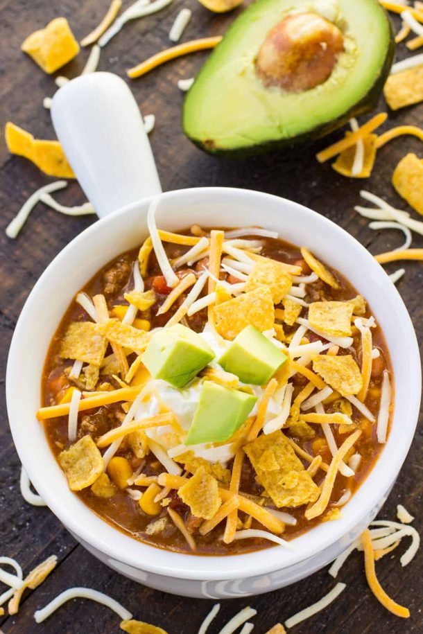 instant pot taco soup with shredded cheese tortilla chips and avocado chunks