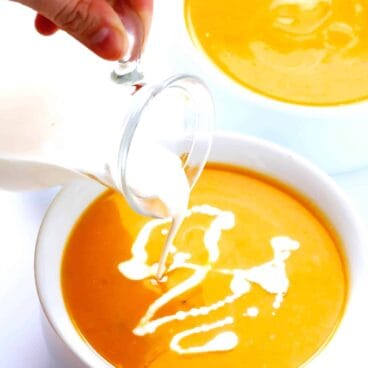 instant pot butternut squash soup with a drizzle of cream