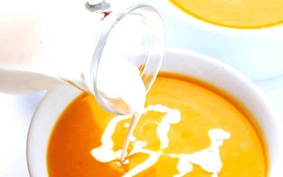 instant pot butternut squash soup with a drizzle of cream