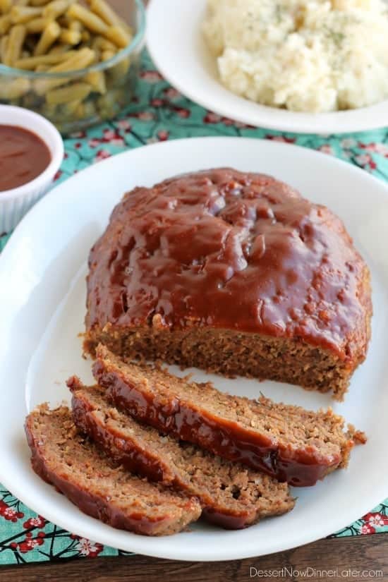 ground beef crock pot meat loaf on white plate with 3 slices cut