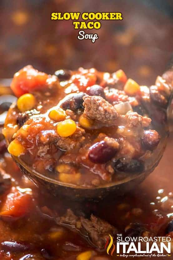 slow cooker ground beef taco soup close up shot of scoop filled with soup