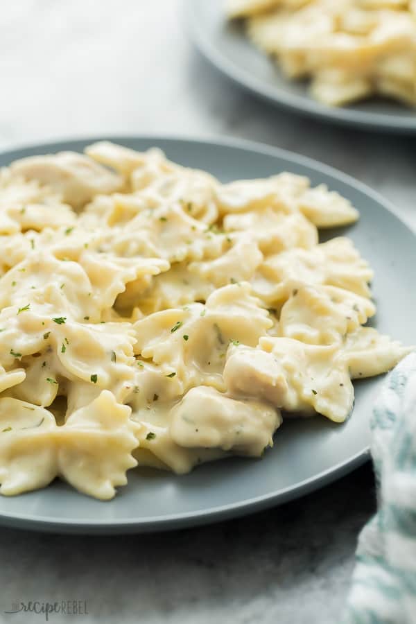 instant pot chicken alfredo pasta on grey plate on grey marble background