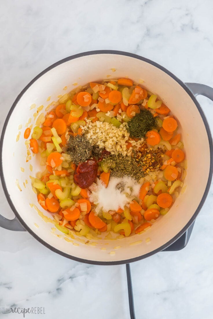 carrots onions celery and spices sauteeing in large pot