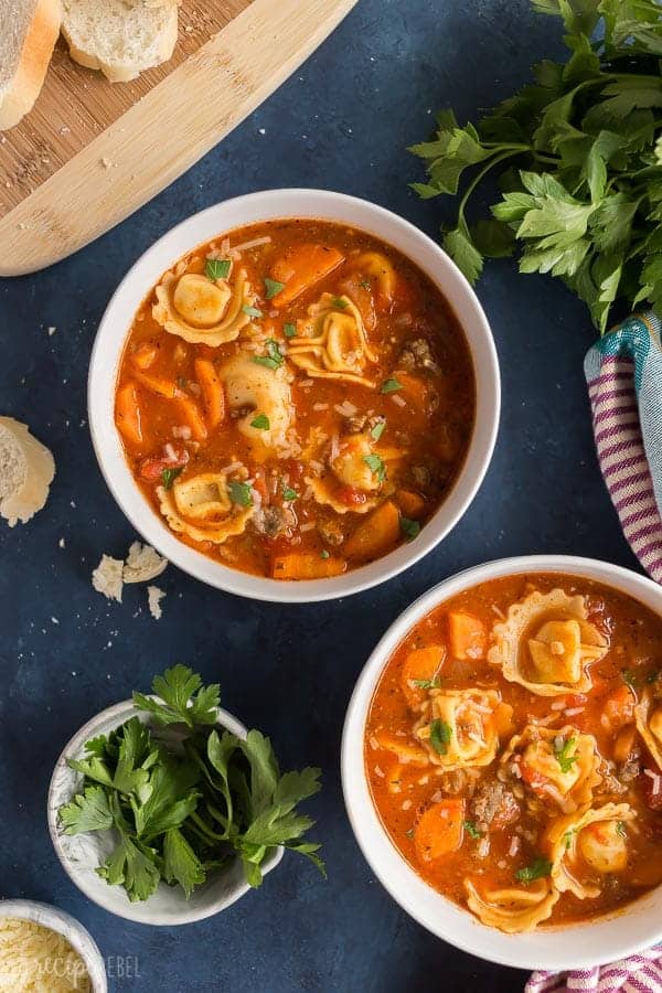 sausage tortellini soup overhead white bowls