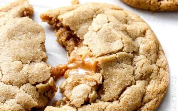 one caramel stuffed cookie broken apart.