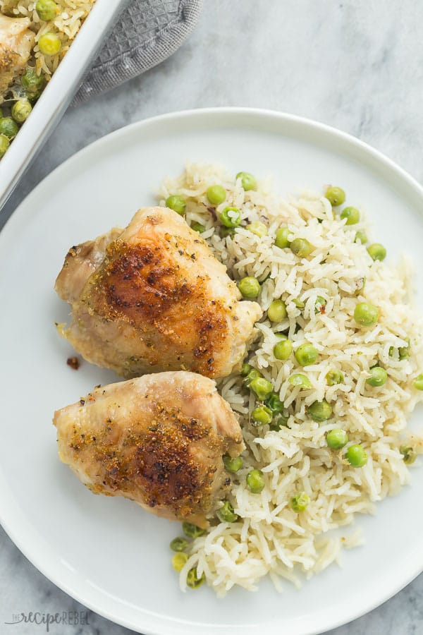 chicken and rice bake plated on white plate on grey marble background