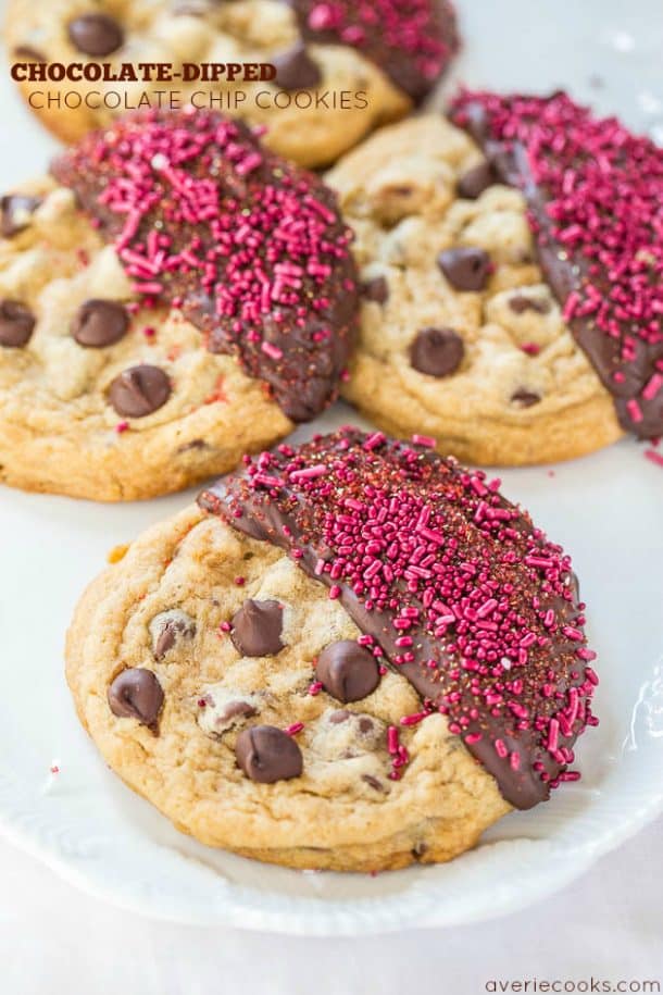 chocolate dipped cookies with pink sprinkles on white background